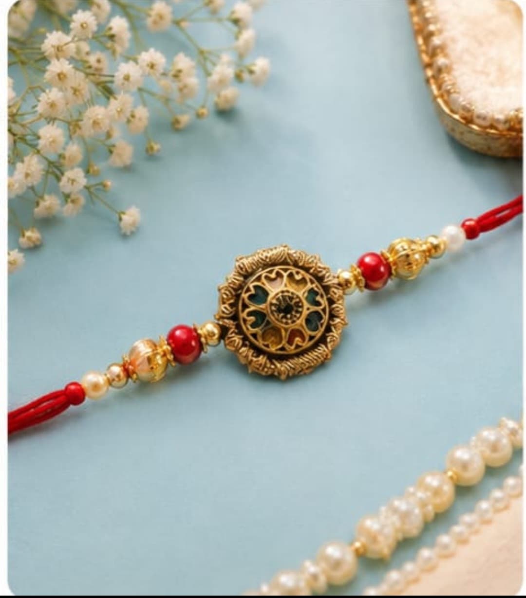 Kundan Meenakari Flower Rakhi with Pearl & Maroon Beads